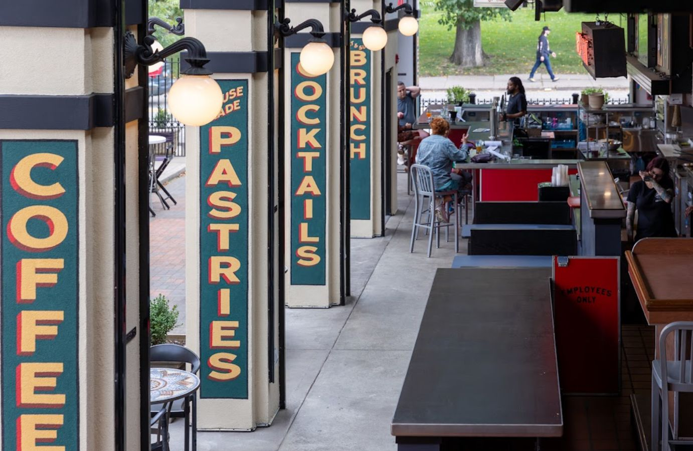 Lawrenceville cafe storefront with hand-painted Coffee, Pastries and Cocktails signs